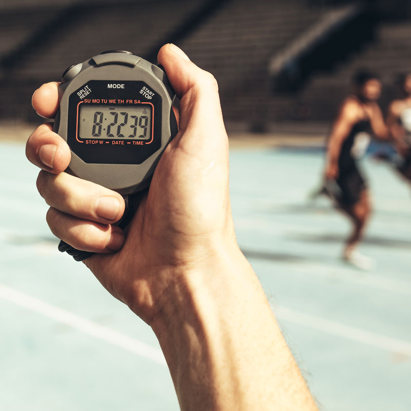 hand holding stopwatch