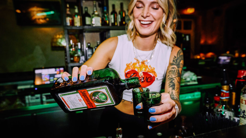 bar tender serves jaegermeister