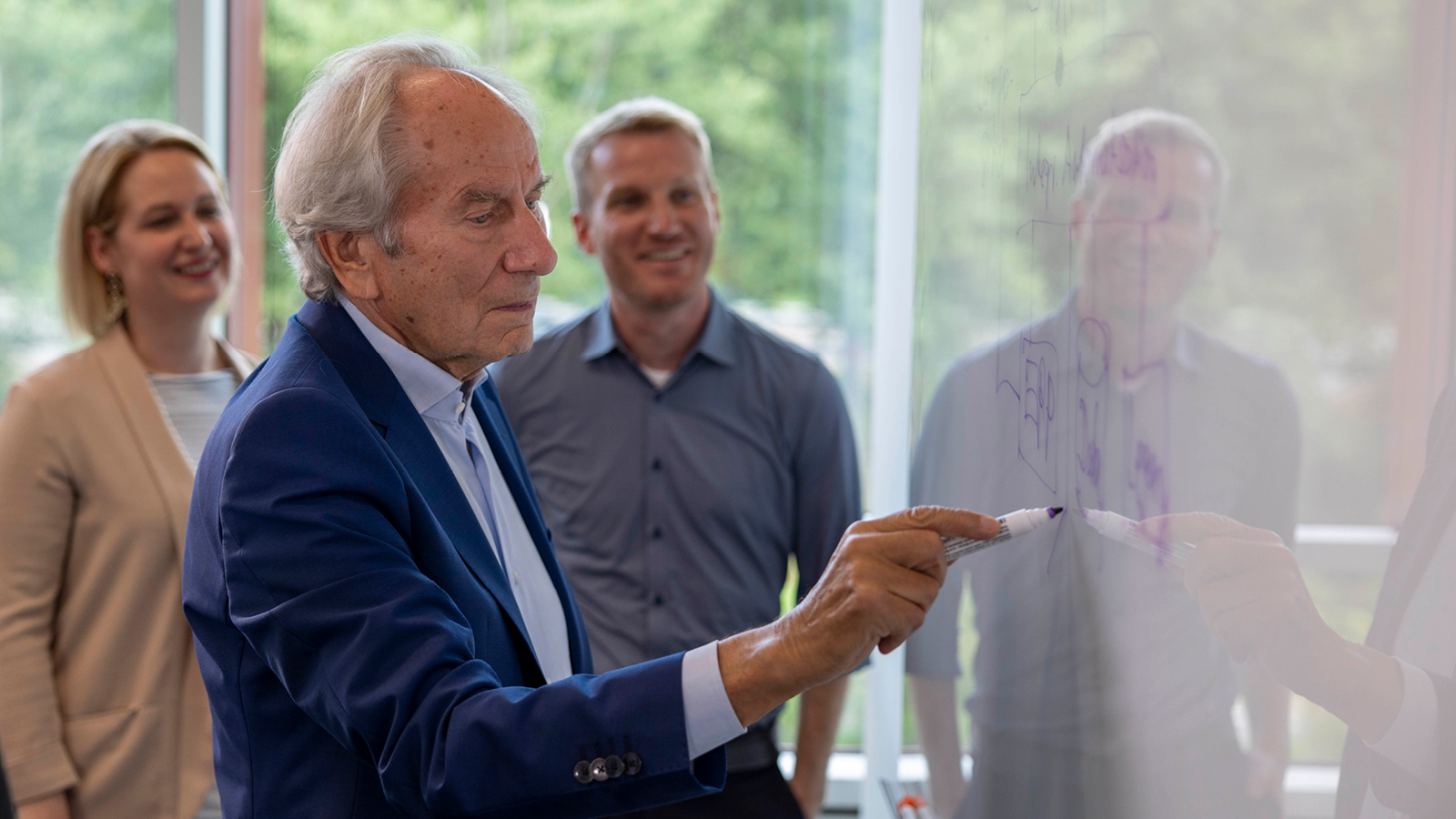 Prof. Scheer explaining theory to colleagues